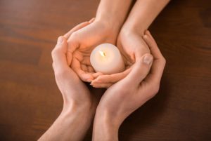 candle on hands